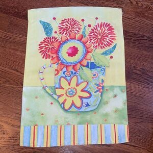 Multi‎ colored flowers in a cup garden flag